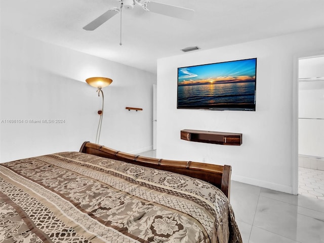 bedroom with ceiling fan and light tile patterned floors