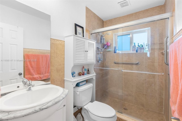 bathroom featuring walk in shower, vanity, and toilet