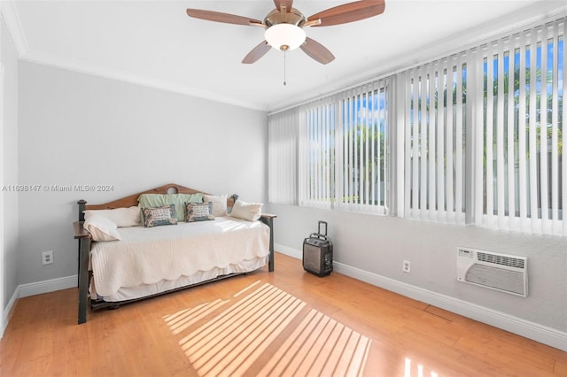 bedroom featuring wood-type flooring, ceiling fan, and crown molding