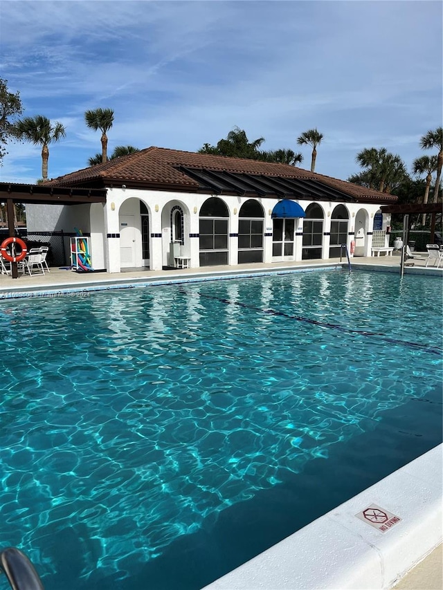 view of swimming pool with a patio area