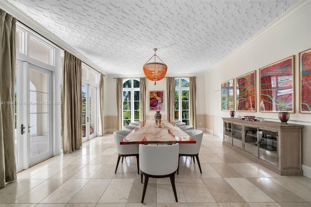 dining space with crown molding, french doors, and a textured ceiling