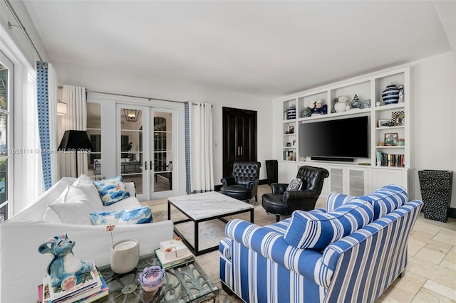3305 S Moorings Way, Miami, FL 33133 - living area featuring french doors, stone tile floors, and built in features