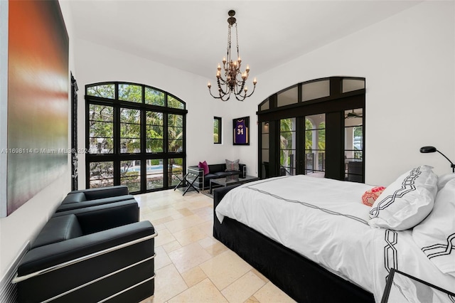 bedroom with a notable chandelier and french doors