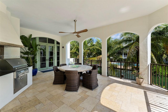 view of patio featuring ceiling fan and french doors