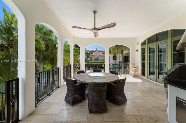 view of patio / terrace with ceiling fan and french doors