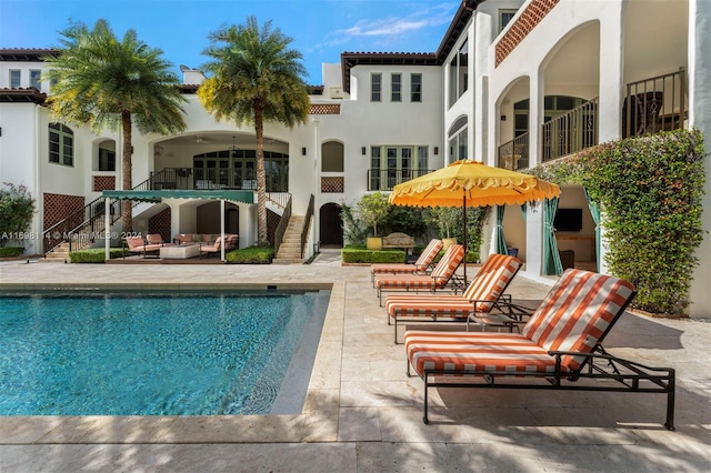 view of swimming pool featuring a patio area