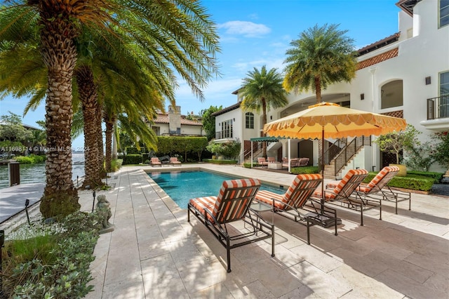 view of pool featuring a patio area