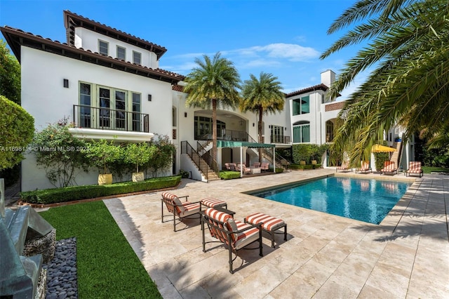 3305 S Moorings Way, Miami, FL 33133 - swimming pool with stairs, a patio area, and an outdoor living space