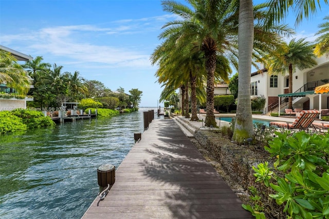 dock area with a water view