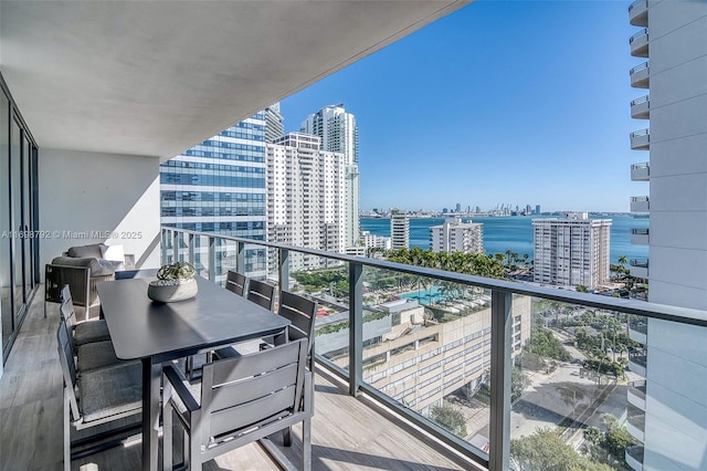 balcony with a city view and a water view