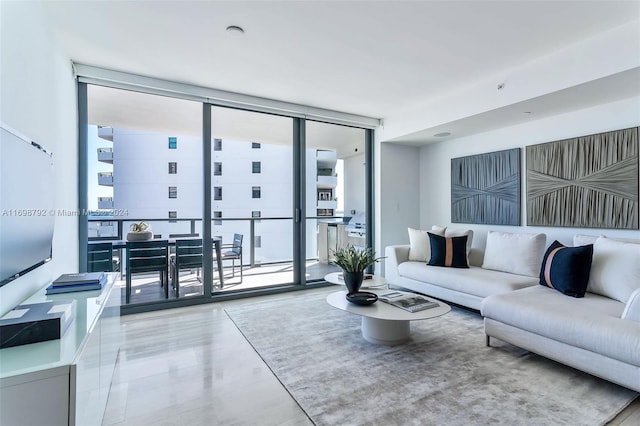 living room featuring floor to ceiling windows