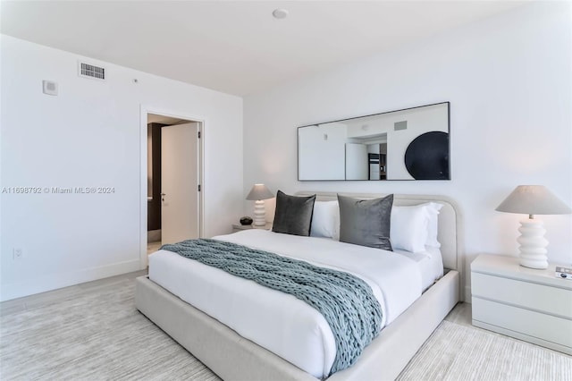 bedroom with light hardwood / wood-style flooring