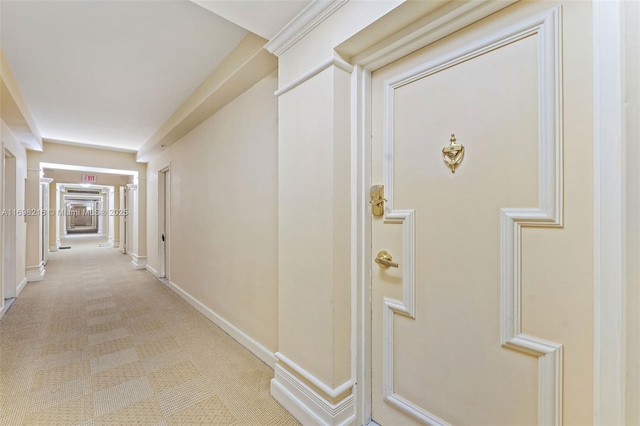 5700 Collins Ave Unit 5B, Miami Beach, FL 33140 - corridor featuring baseboards and light colored carpet