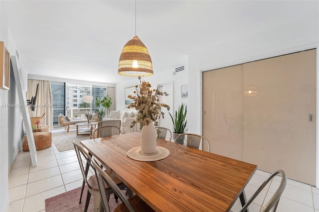 5700 Collins Ave Unit 5B, Miami Beach, FL 33140 - dining space with light tile patterned flooring