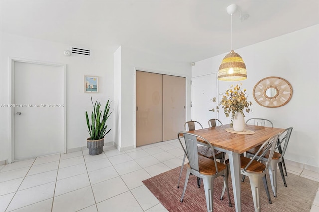 5700 Collins Ave Unit 5B, Miami Beach, FL 33140 - dining room with light tile patterned flooring
