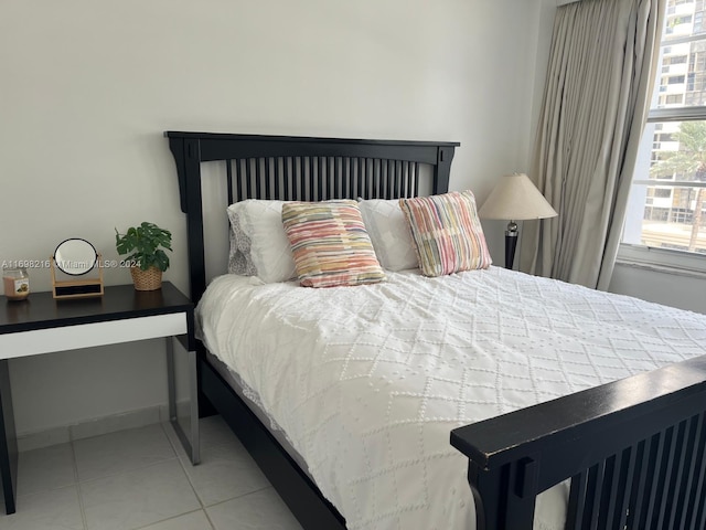 bedroom featuring light tile patterned floors