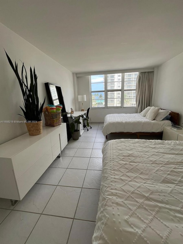 bedroom featuring light tile patterned floors