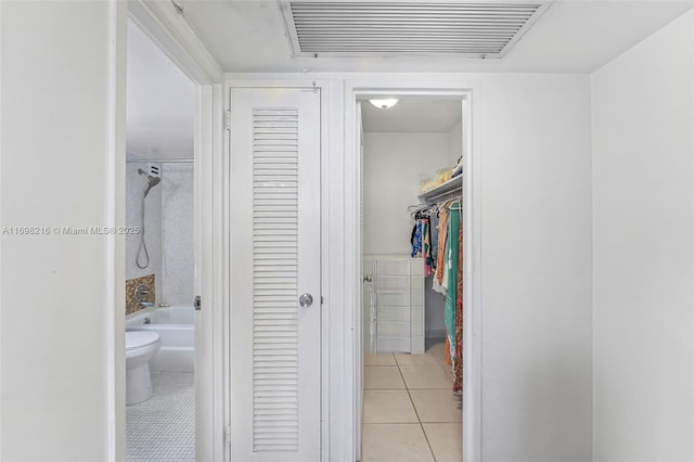 5700 Collins Ave Unit 5B, Miami Beach, FL 33140 - corridor with light tile patterned floors