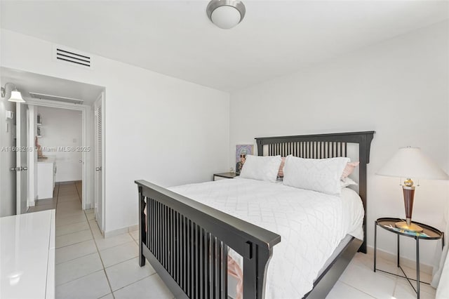 5700 Collins Ave Unit 5B, Miami Beach, FL 33140 - bedroom with light tile patterned floors