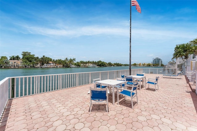 5700 Collins Ave Unit 5B, Miami Beach, FL 33140 - view of patio / terrace with a water view and outdoor dining area