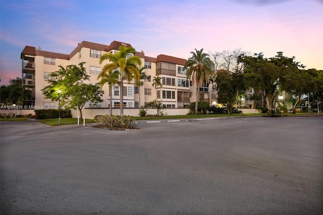 view of outdoor building at dusk