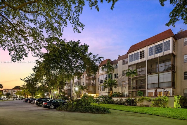 view of outdoor building at dusk