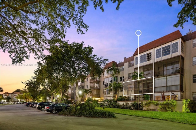 view of outdoor building at dusk