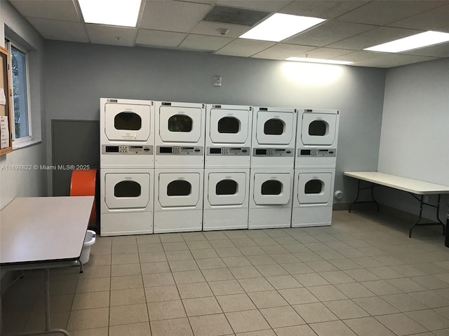 shared laundry area with stacked washer and dryer and washing machine and clothes dryer