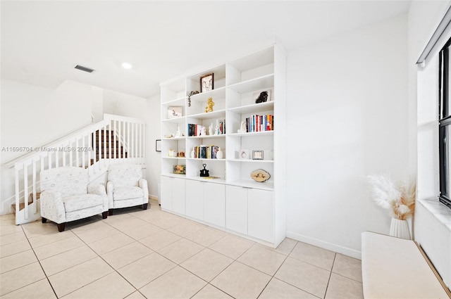 bedroom featuring light tile patterned flooring