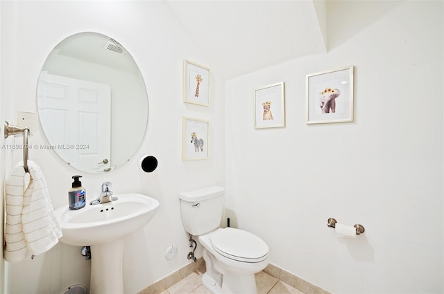 bathroom with tile patterned floors and toilet