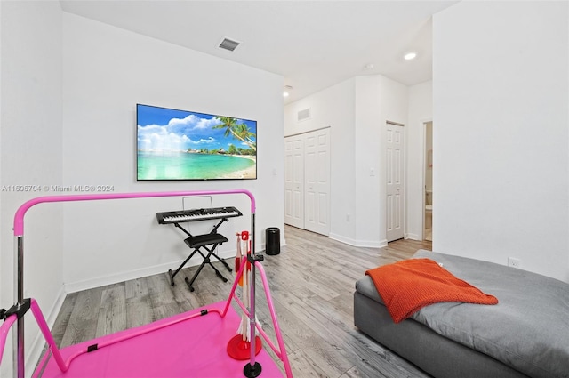 bedroom featuring light hardwood / wood-style flooring and a closet