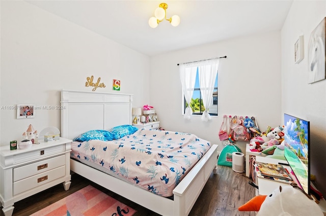 bedroom with dark wood-type flooring