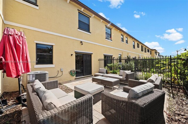 4641 Caspian Way, Davie, FL 33314 - view of patio / terrace featuring outdoor lounge area and central air condition unit