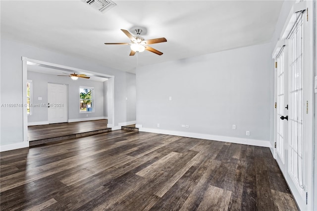 unfurnished living room featuring french doors and hardwood / wood-style flooring