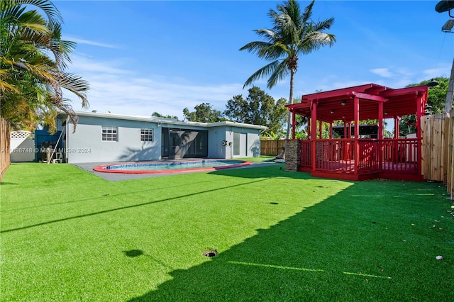 view of yard featuring a swimming pool side deck