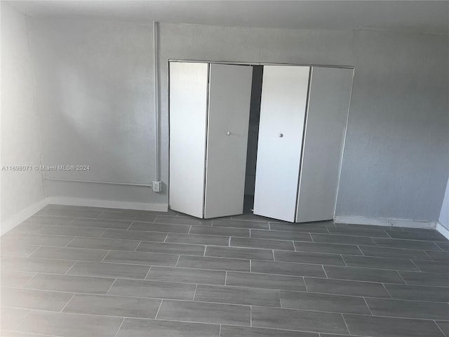 unfurnished bedroom with a closet