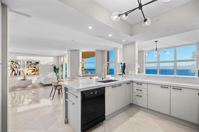 kitchen featuring kitchen peninsula, sink, a water view, black dishwasher, and white cabinetry