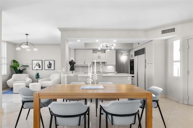 dining space featuring an inviting chandelier