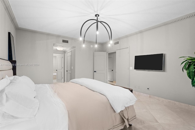 tiled bedroom with ensuite bathroom and ornamental molding