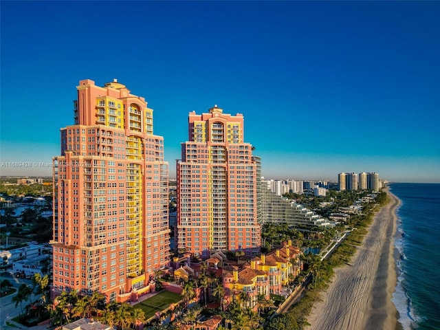 view of city featuring a water view and a view of the beach