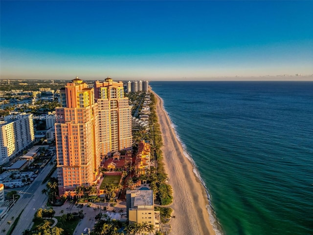 aerial view featuring a view of the beach and a water view