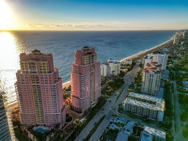 aerial view at dusk with a water view