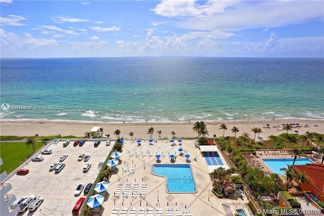 bird's eye view with a water view and a view of the beach