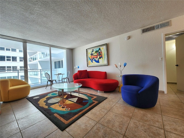 2030 S Ocean Dr Unit 604, Hallandale Beach, FL 33009 - living room featuring tile patterned flooring, a textured ceiling, and floor to ceiling windows