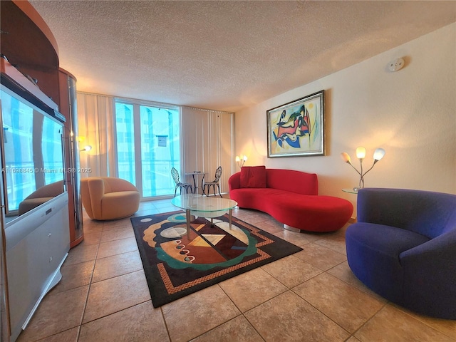 tiled living room with floor to ceiling windows and a textured ceiling