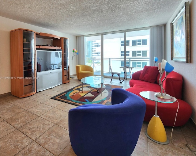 2030 S Ocean Dr Unit 604, Hallandale Beach, FL 33009 - living area featuring a textured ceiling, tile patterned flooring, and a wall of windows