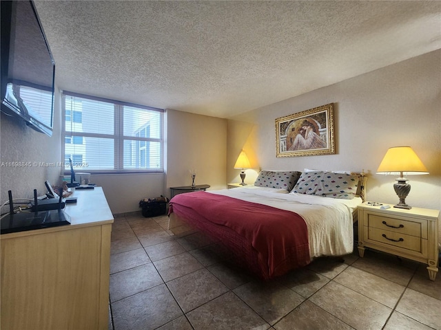 tiled bedroom featuring a textured ceiling