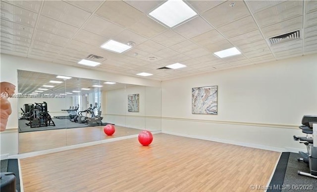 2030 S Ocean Dr Unit 604, Hallandale Beach, FL 33009 - gym featuring wood finished floors, a paneled ceiling, and baseboards