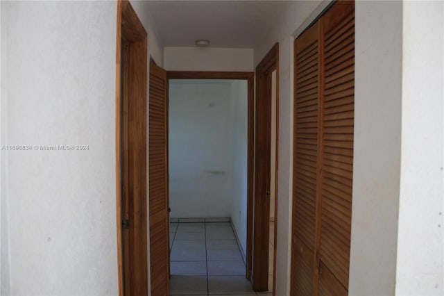 hallway with light tile patterned floors