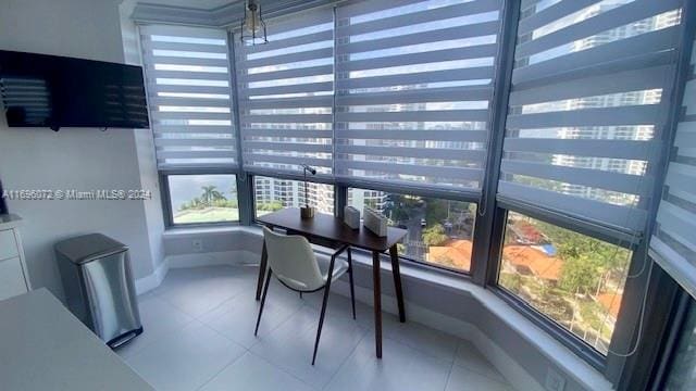 sunroom / solarium featuring a healthy amount of sunlight